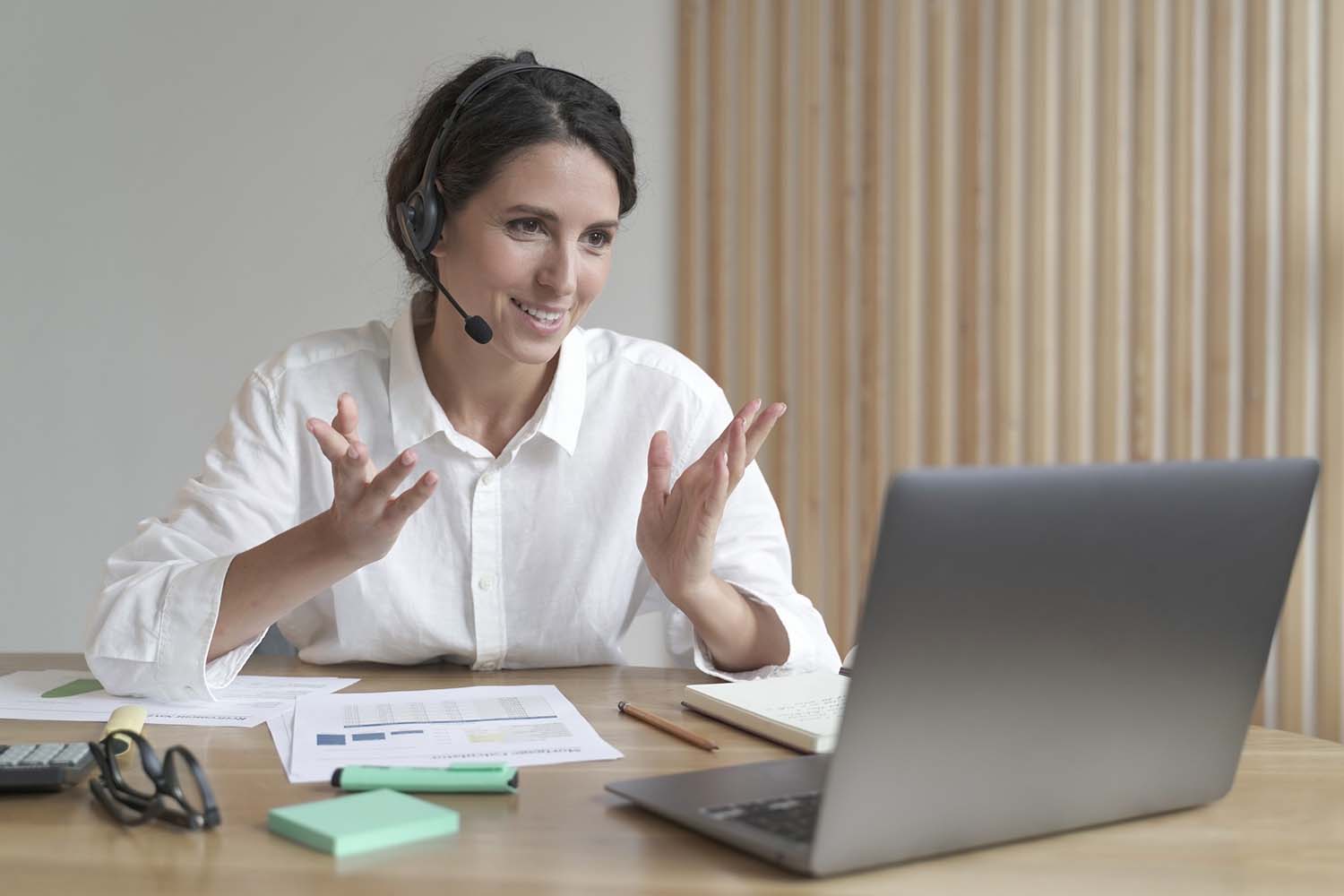 A woman wearing a VoIP headset