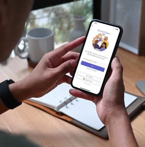 Person holds a smartphone device in their hands while they setup G12 Operator Connect for Microsoft Teams